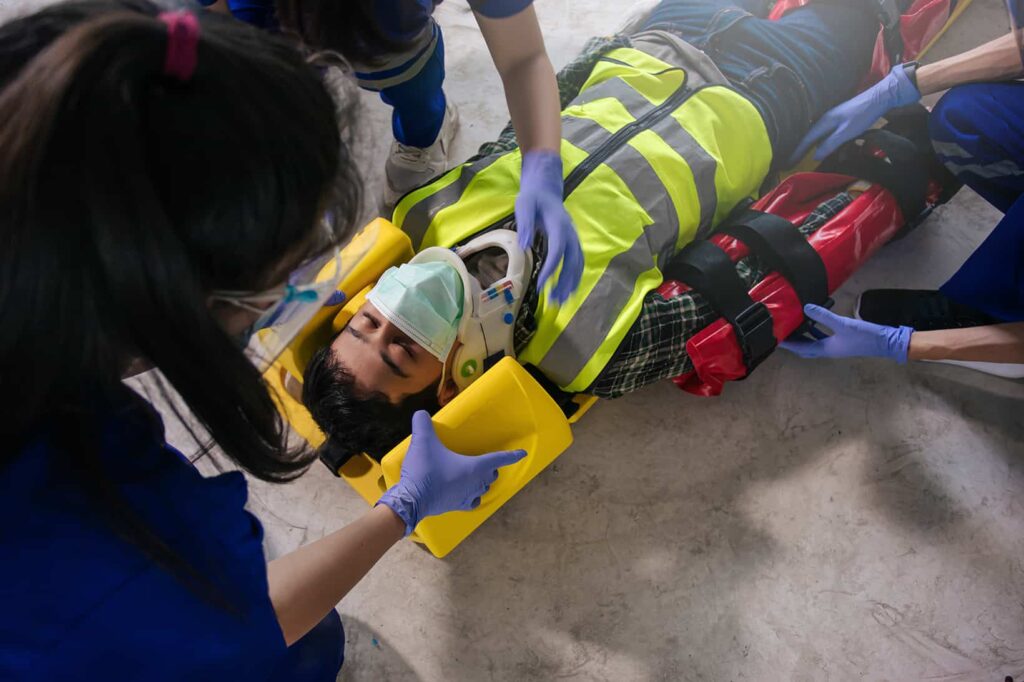 person being carried to ambulance